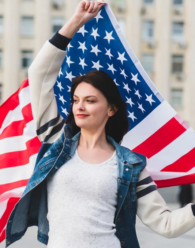 A passionate supporter holding the American flag, representing unity and hope for our nation's future